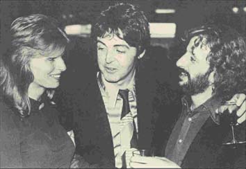 Together again: Paul and Linda are pictured chatting to another ex-Beatle - Ringo Starr - at a reception.